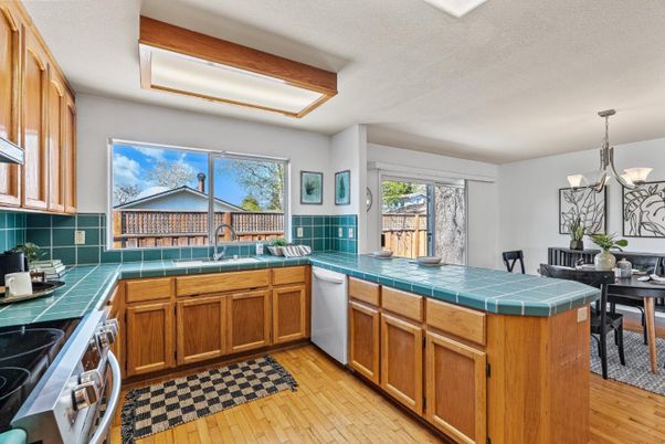 Dining room, Interior, Kitchen, Pendant Lights, Tile Countertops, Wood Texture Flooring
