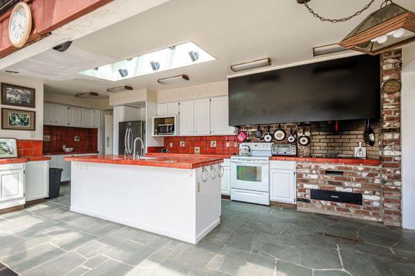 Interior, Kitchen, Stainless Steel Appliances, Stone Walls, Tile Countertops