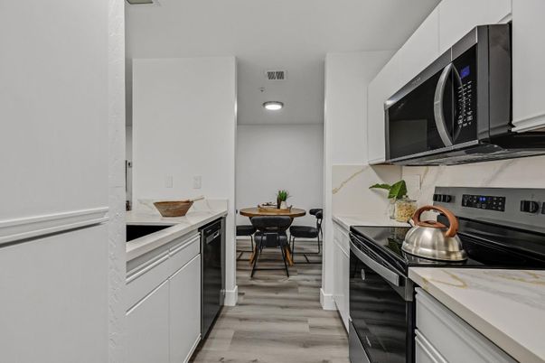Dining room, Interior, Kitchen, Recessed Lighting, Stainless Steel Appliances, Wood Texture Flooring
