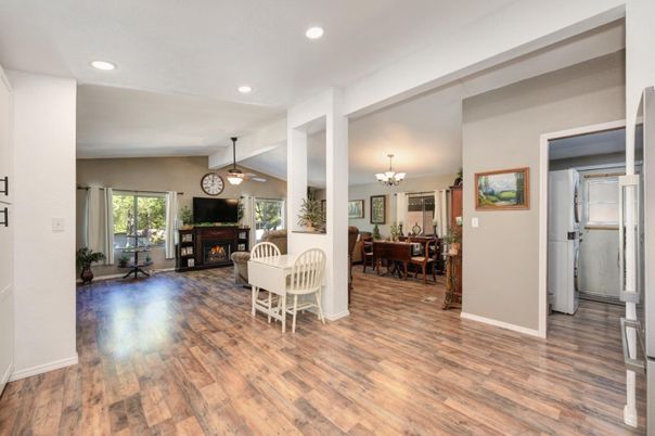 Chandelier, Dining room, Fireplace, Interior, Living room, Recessed Lighting, Wood Texture Flooring