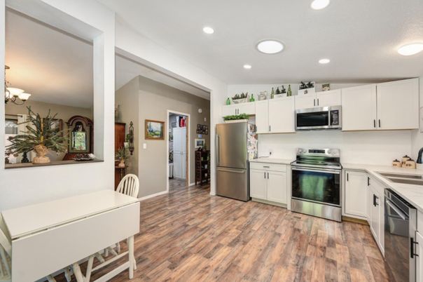 Chandelier, Interior, Kitchen, Recessed Lighting, Stainless Steel Appliances, Wood Texture Flooring