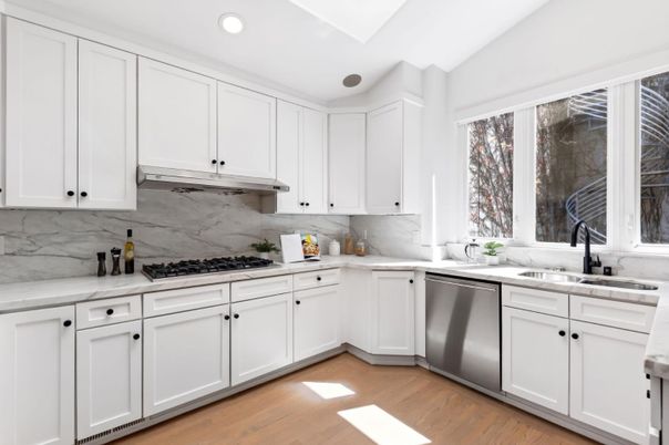 Interior, Kitchen, Marble Walls, Recessed Lighting, Stainless Steel Appliances, Wood Texture Flooring