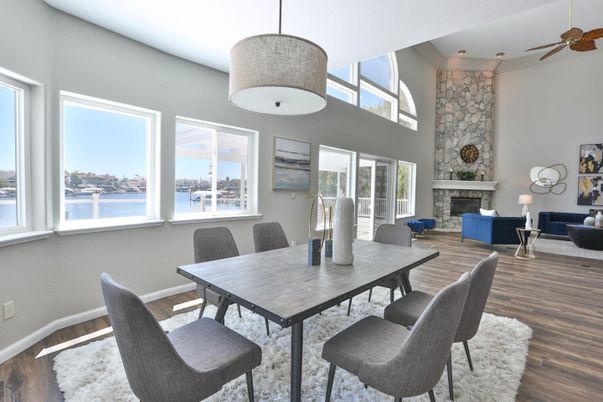 Dining room, Fireplace, Interior, Living room, Pendant Lights, Stone Walls, Water, Wood Texture Flooring