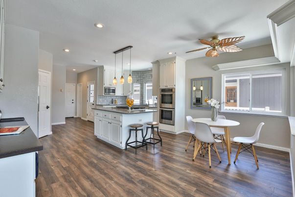 Dining room, Interior, Kitchen, Pendant Lights, Recessed Lighting, Stainless Steel Appliances, Wood Texture Flooring