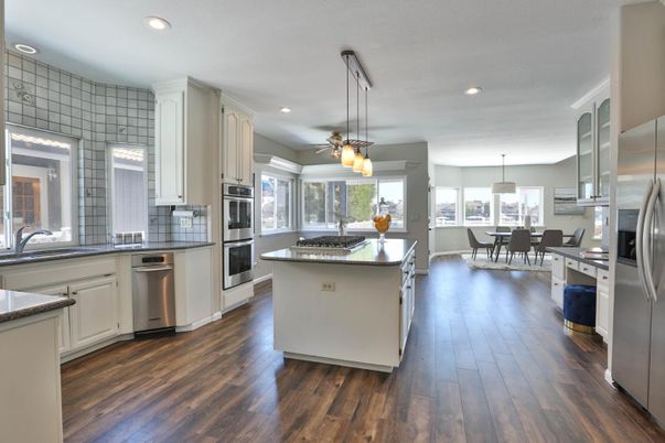 Dining room, Interior, Kitchen, Pendant Lights, Recessed Lighting, Stainless Steel Appliances, Wood Texture Flooring