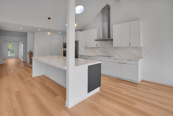 Interior, Kitchen, Marble Walls, Pendant Lights, Recessed Lighting, Wood Texture Flooring