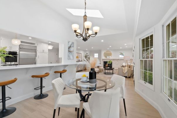 Chandelier, Dining room, Fireplace, Interior, Kitchen, Living room, Recessed Lighting, Stainless Steel Appliances, Wood Texture Flooring