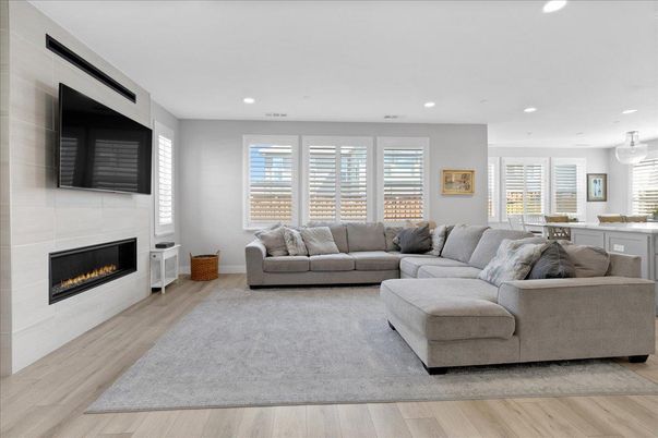Dining room, Fireplace, Interior, Living room, Pendant Lights, Recessed Lighting, Wood Texture Flooring