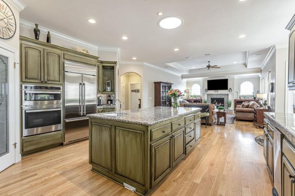 Fireplace, Interior, Kitchen, Living room, Recessed Lighting, Stainless Steel Appliances, Wood Texture Flooring