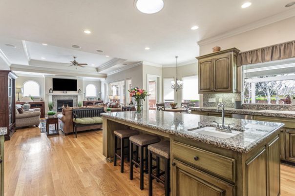 Chandelier, Fireplace, Interior, Kitchen, Living room, Recessed Lighting, Wood Texture Flooring