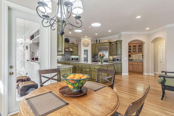 Chandelier, Dining room, Interior, Kitchen, Recessed Lighting, Stainless Steel Appliances, Wood Texture Flooring