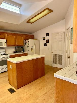 Interior, Kitchen, Tile Countertops, Wood Texture Flooring