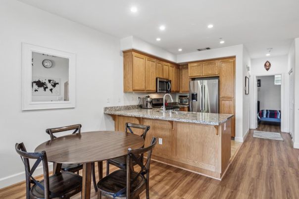 Dining room, Interior, Kitchen, Recessed Lighting, Stainless Steel Appliances, Wood Texture Flooring