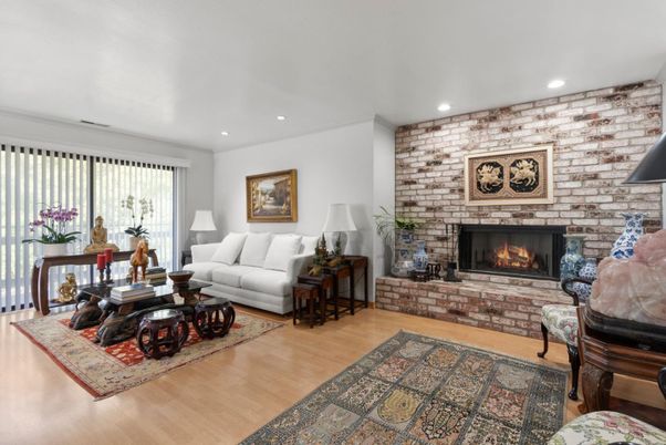 Fireplace, Interior, Living room, Recessed Lighting, Stone Walls, Wood Texture Flooring
