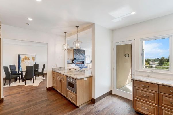 Dining room, Interior, Kitchen, Pendant Lights, Recessed Lighting, Stainless Steel Appliances, Wood Texture Flooring