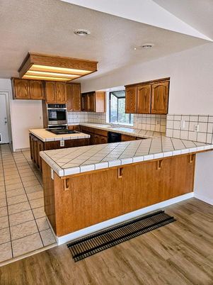 Interior, Kitchen, Recessed Lighting, Tile Countertops, Wood Texture Flooring