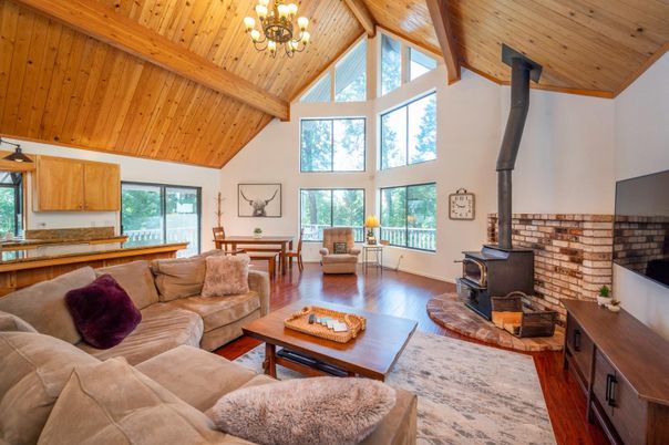 Chandelier, Dining room, Fireplace, Interior, Living room, Stone Walls, Wooden Beams, Wooden Ceilings, Wood Texture Flooring