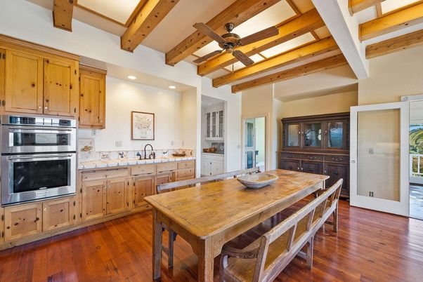 Dining room, Interior, Kitchen, Recessed Lighting, Stainless Steel Appliances, Tile Countertops, Wooden Beams, Wood Texture Flooring