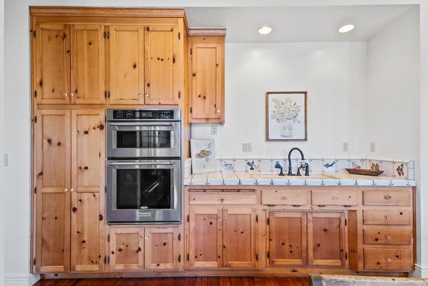 Interior, Kitchen, Recessed Lighting, Stainless Steel Appliances, Tile Countertops, Wood Texture Flooring