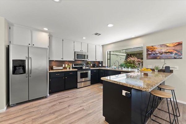 Interior, Kitchen, Recessed Lighting, Stainless Steel Appliances, Wood Texture Flooring