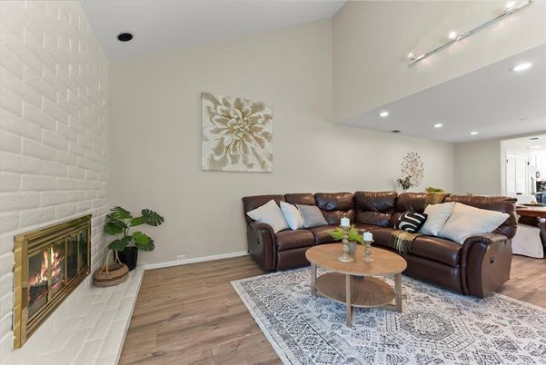 Fireplace, Interior, Living room, Recessed Lighting, Stone Walls, Wood Texture Flooring