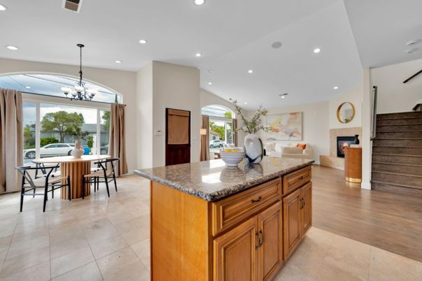 Chandelier, Dining room, Fireplace, Interior, Living room, Pendant Lights, Recessed Lighting, Wood Texture Flooring