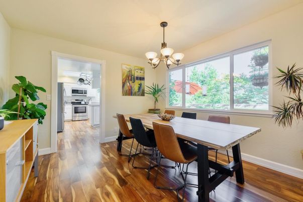 Chandelier, Dining room, Interior, Kitchen, Stainless Steel Appliances, Wood Texture Flooring