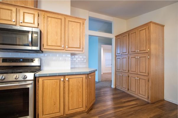 Interior, Kitchen, Stainless Steel Appliances, Tile Countertops, Wood Texture Flooring
