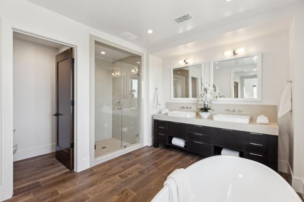 Bathroom, Dual Sink Vanities, Free Standing Baths, Glass Shower, Interior, Recessed Lighting, Wood Texture Flooring