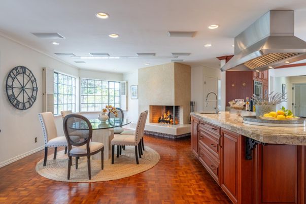 Dining room, Fireplace, Interior, Kitchen, Recessed Lighting, Stainless Steel Appliances, Wood Texture Flooring