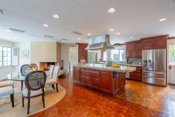Dining room, Fireplace, Interior, Kitchen, Living room, Recessed Lighting, Stainless Steel Appliances, Wood Texture Flooring