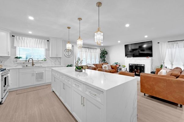 Fireplace, Interior, Kitchen, Living room, Pendant Lights, Recessed Lighting, Stainless Steel Appliances, Wood Texture Flooring