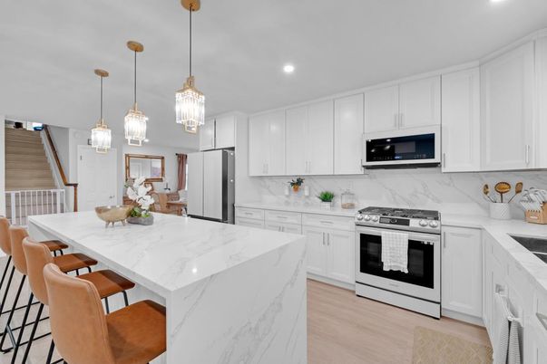Interior, Kitchen, Marble Walls, Pendant Lights, Recessed Lighting, Stainless Steel Appliances, Wood Texture Flooring