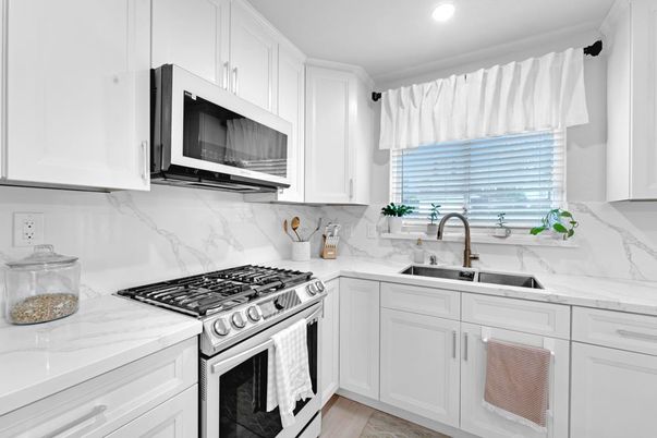 Interior, Kitchen, Marble Walls, Recessed Lighting, Stainless Steel Appliances, Wood Texture Flooring