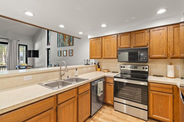 Interior, Kitchen, Recessed Lighting, Stainless Steel Appliances, Wood Texture Flooring