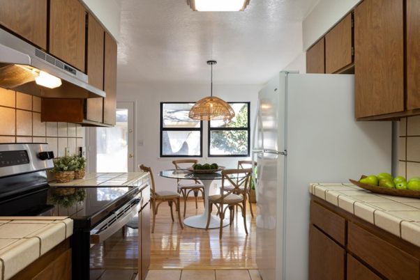 Dining room, Interior, Kitchen, Pendant Lights, Stainless Steel Appliances, Tile Countertops