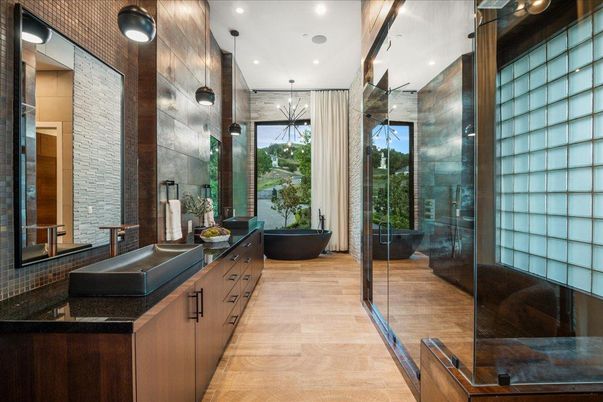 Bathroom, Dual Sink Vanities, Free Standing Baths, Glass Shower, Interior, Pendant Lights, Recessed Lighting, Wood Texture Flooring