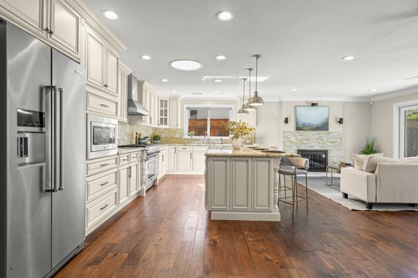 Fireplace, Interior, Kitchen, Living room, Pendant Lights, Recessed Lighting, Stainless Steel Appliances, Wood Texture Flooring