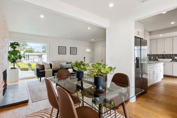 Dining room, Fireplace, Interior, Kitchen, Living room, Recessed Lighting, Stainless Steel Appliances, Wood Texture Flooring