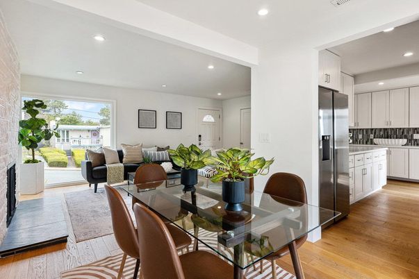 Dining room, Fireplace, Interior, Kitchen, Living room, Recessed Lighting, Stainless Steel Appliances, Wood Texture Flooring