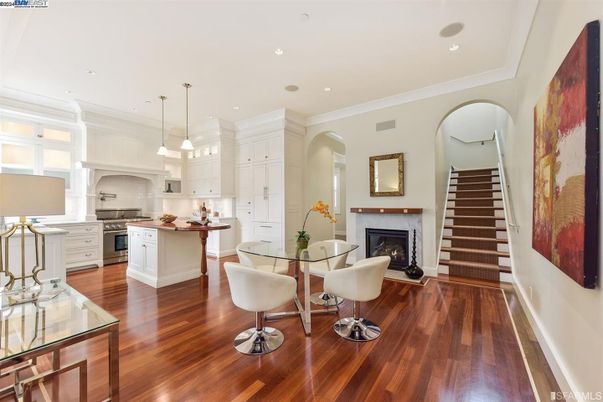 Dining room, Fireplace, Interior, Kitchen, Pendant Lights, Recessed Lighting, Stainless Steel Appliances, Wood Texture Flooring