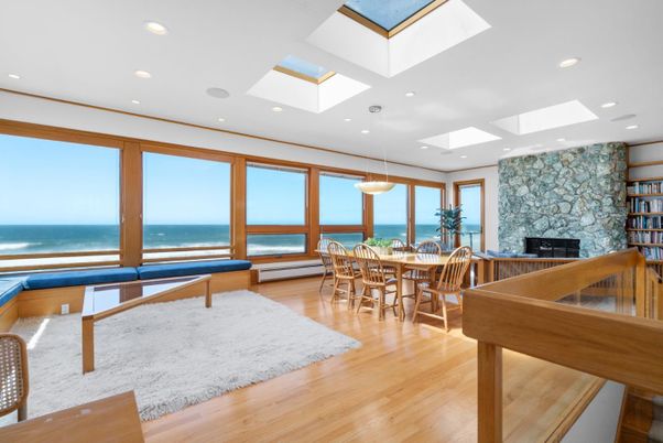 Dining room, Fireplace, Interior, Pendant Lights, Recessed Lighting, Stone Walls, Water, Wood Texture Flooring