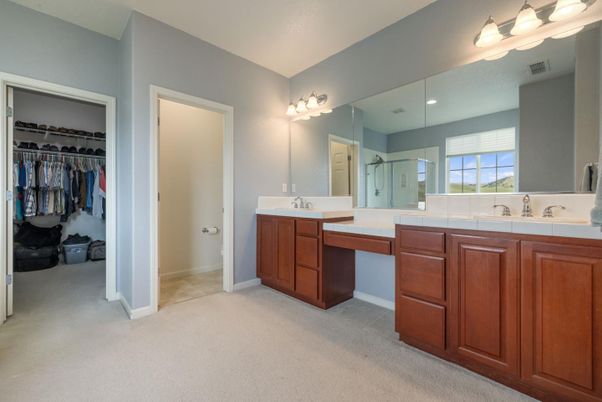Bathroom, Dual Sink Vanities, Interior, Recessed Lighting, Tile Countertops, Walk-in Closets