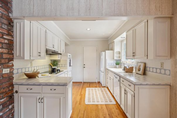 Interior, Kitchen, Recessed Lighting, Stone Walls, Tile Countertops, Wood Texture Flooring