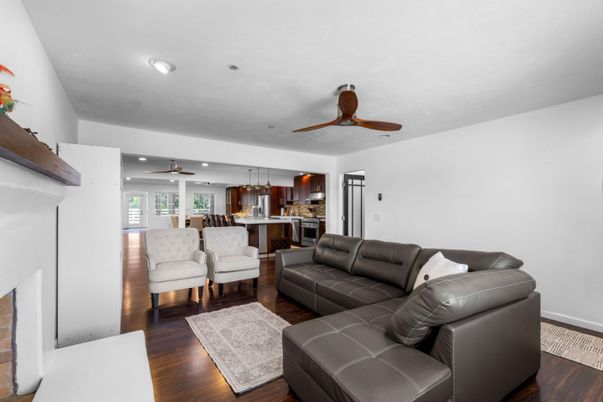 Fireplace, Interior, Kitchen, Living room, Pendant Lights, Recessed Lighting, Stainless Steel Appliances, Wood Texture Flooring