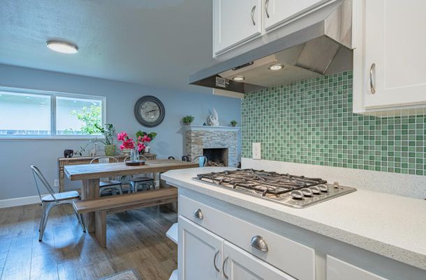 Dining room, Fireplace, Interior, Kitchen, Recessed Lighting, Wood Texture Flooring