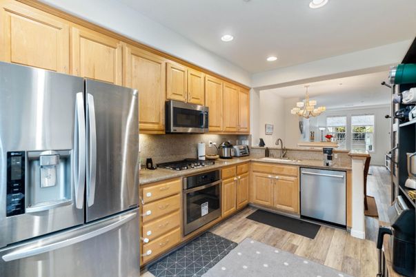 Chandelier, Interior, Kitchen, Recessed Lighting, Stainless Steel Appliances, Wood Texture Flooring