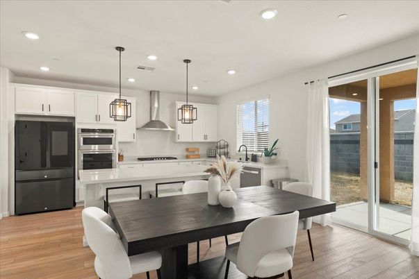 Dining room, Interior, Kitchen, Pendant Lights, Recessed Lighting, Stainless Steel Appliances, Wood Texture Flooring