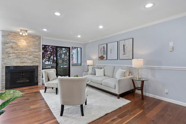 Fireplace, Interior, Living room, Recessed Lighting, Stone Walls, Wood Texture Flooring