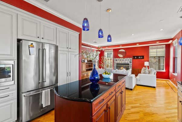 Fireplace, Interior, Kitchen, Living room, Pendant Lights, Recessed Lighting, Stainless Steel Appliances, Wood Texture Flooring
